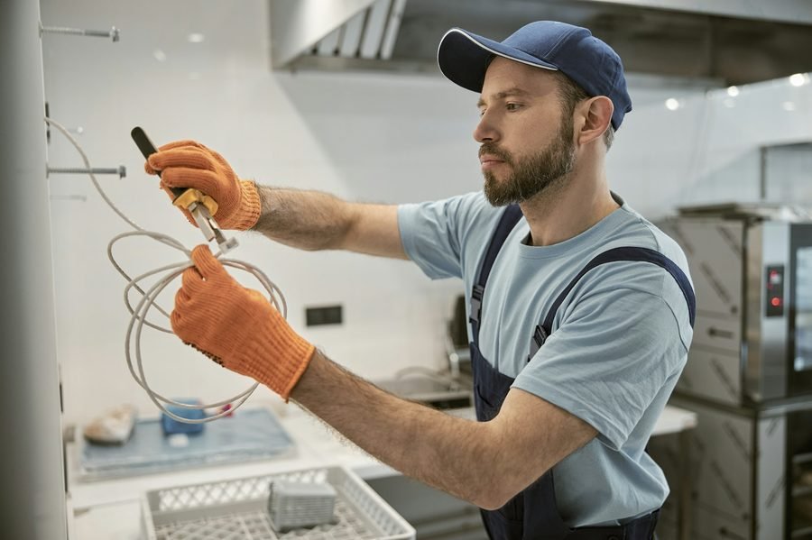 Wiring inside a wall box during outlet replacement in an Ogden, Utah home